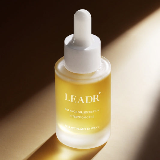 LEADR skincare serum bottle on a warm-toned background