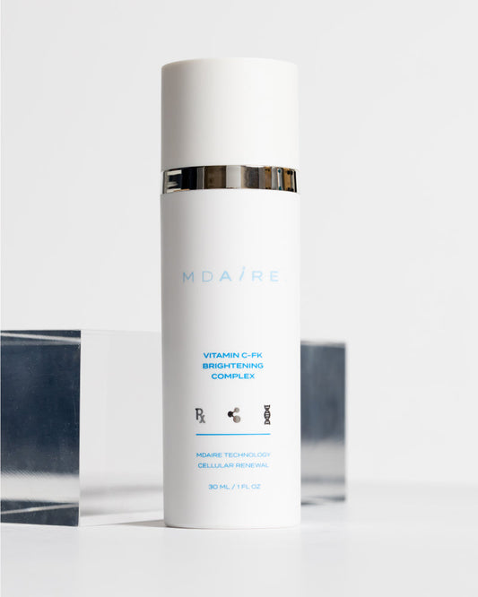 Skincare bottle with 'MDAiRE' branding on a white background