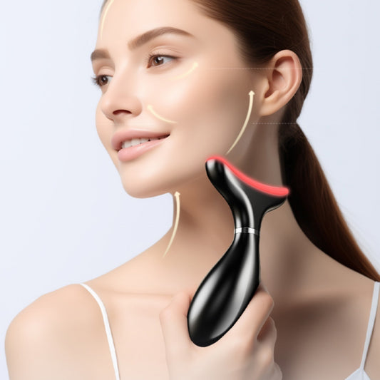 Woman using a black and red neck massager on her neck against a light gray background