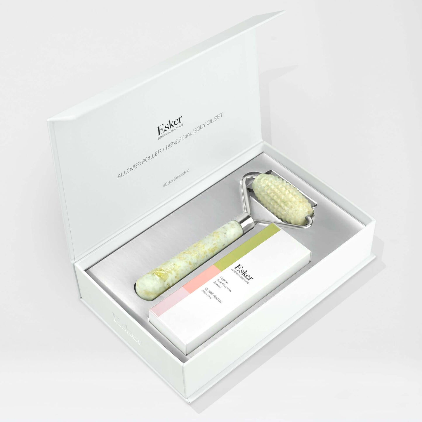 Esker skincare product giftset with roller and cream in a box on a white background