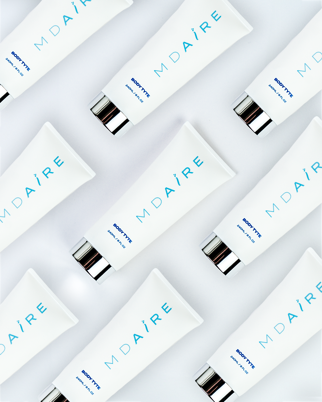 MDAiRE Body Tyte tube products arranged in a grid on a light gray background