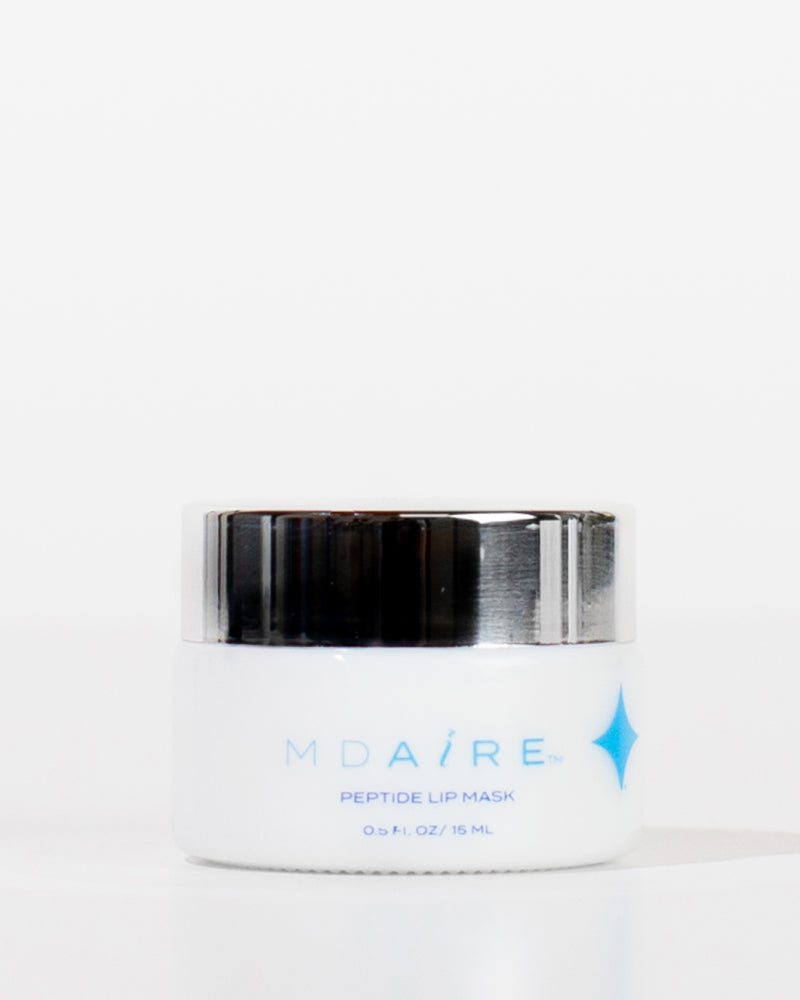 White jar with black lid labeled 'MDAiRE Peptide Lip Mask' on a white background
